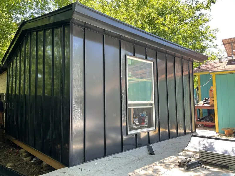 Black standing seam metal wall panels for Roof Inspection in Minot