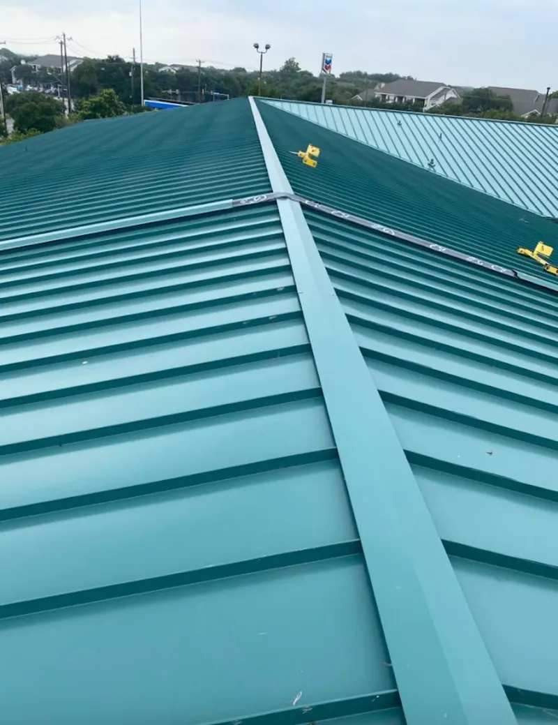 Green commercial metal roof ridge and valley for Metal Roof Repair in Minot
