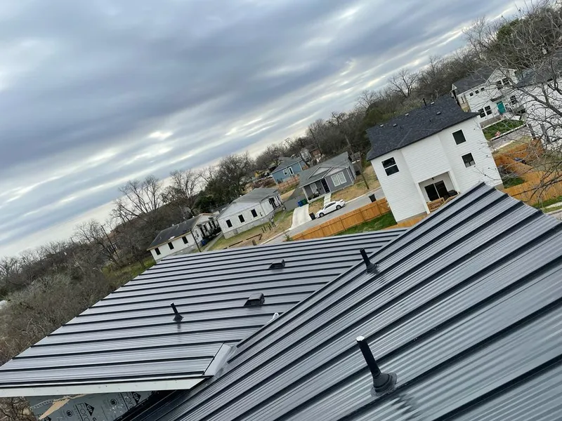 Standing seam metal roof panels with vents for Skylight Repair in Minot